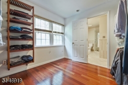 large walk in closet opens to the bathroom & bedroom