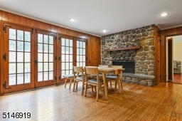 open and spacious family room boasts French sliding doors that lead to the paver patio