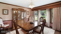 Large Formal Dining Room with access to Kitchen through swinging doors.