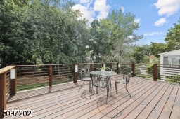 Large modern high-end Ipe (Brazilian hardwood) deck overlooks an expansive outdoor space with magnificent views of Taylor Park. Cleaned and stained in 2021.
