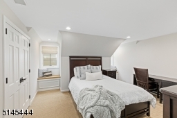 Bedroom 2 with wall-to-wall carpeting, recessed lights, two window seats and a double fitted closet