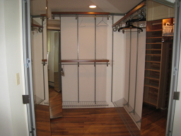 AN EXTRA STORAGE AREA IN REAR OF MIRRORED CLOSET