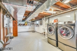 Fully functioning laundry room with plenty of space! Completed with an epoxy floor coating.