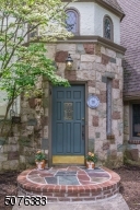 Welcome home to this storybook Tudor that's bursting with rich millwork, arched pass-throughs, spacious fluid rooms and natural oak floors. Natural light floods almost every corner of this 4 bedroom, 2.5 bath home.