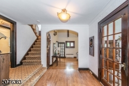 The breathtaking beauty of this home begins as you walk up the blue stone walkway to a captivating two story trundle foyer showcased by spectacular architectural leaded windows.