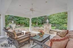 What a cozy porch! sit outside and enjoy barbecuing in your private yard under your covered patio.
