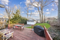 Oversized Wood Deck overlooking the level rear yard