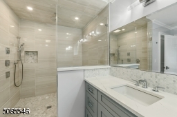 Bathroom with soaking tub, extra large shower with body sprays, handheld and rainhead, double vanity