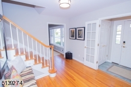 You enter this space from an entrance vestibule with coat closet and double doors to front door.