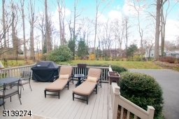 You can access this deck from Kitchen sliders and gives you access to driveway/garages.