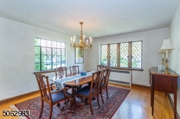Enjoy dinner in the dining room that easily holds a table for 10, with leaded-glass windows that add architectural interest and sparkle to the room