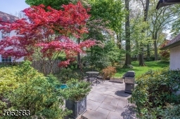 Nothing says summer more than throwing a dinner party al fresco style on the large bluestone patio overlooking the deep, bucolic yard surrounded by perennials, flowering trees and shrubs, and mature trees.