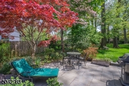 Nothing says summer more than throwing a dinner party al fresco style on the large bluestone patio overlooking the deep, bucolic yard surrounded by perennials, flowering trees and shrubs, and mature trees.