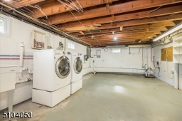 Large laundry & mechanical room with lots of room for storage.