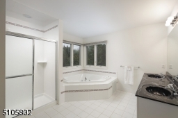 Master bath with jetted tub and oversized shower.