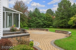 Gorgeous paver patio leads you to the lush and private backyard.