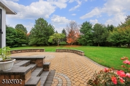 Another view of the paver patio and beautiful yard.