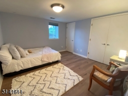 Ground level bedroom w/vinyl tile floors and double closet