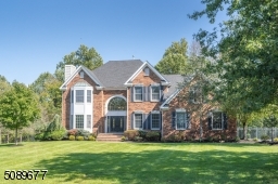 The stunning brick home is located on a cul-de-sac in Warren's sought after neighborhood of Warren Rise.