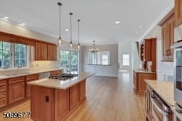 he large kitchen is the perfect place to entertain. It has space for barstools and a sizable table.