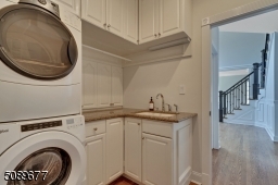 The laundry room has wonderful storage and a sink!