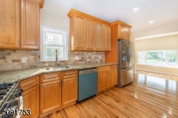 Newly renovated kitchen with new cabinets, new appliances, and new hardwood floors.