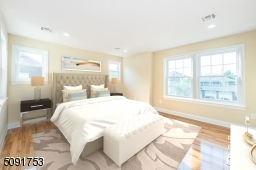 Large master bedroom that has walk in closet along with private bathroom.