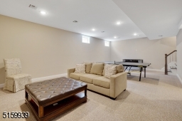Full height (9 ft) ceilings, wall to wall carpeting, plumbing for a future wet bar, Recreation Room, walk-in closet