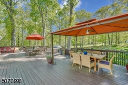This deck is so large it can accommodate several sitting and eating areas.