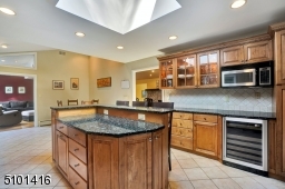 Gourmet kitchen complete with skylight, Viking stove, it even has a beverage refrigerator.