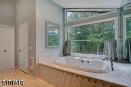 Enjoy the views of your private yard while relaxing in your jetted tub.