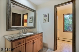 Spacious full bath with a separate sink area.