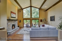 Don't you just love the floor to ceiling windows and soaring ceilings?