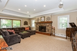 Gas Fireplace, Hardwood Floors Under Carpet, Tray Ceiling, Sliders to Back Porch