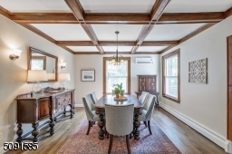 Beautiful coffered ceiling and chestnut trim makes serving a joy.