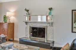 Custom designed marble mantle provides a touch of elegance .
