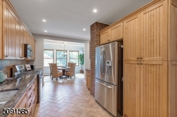 Cabinets galore and granite countertops with access to the backyard and  private deck.