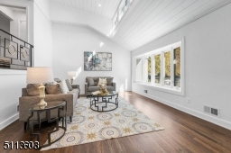 With a two-story shiplap ceiling and tons of light, this living room is a sight to behold.