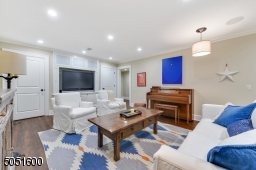Recreation Room / Media Center featuring recessed lights, barrel style pendant lights, built-in speakers, premium vinyl floor, built-in TV flanked by two built-in closets