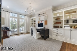 Home Office featuring hardwood floors, built-in cabinets with French Doors to show-stopping bluestone patio