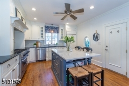 Chefs will love the dream kitchen and breakfast room featuring bright windows, custom cabinetry, a large center island and high-end Viking and Sub-Zero stainless steel appliances.