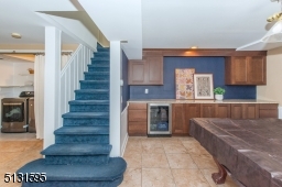 The home's fully finished walk-out lower level includes an expansive rec room, laundry and storage.