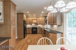 Expansive kitchen featuring granite counter tops