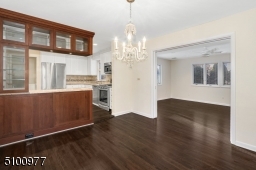 Leading to Family Room and Kitchen. Gorgeous hardwood flooring just refinished and a freshly painted interior.