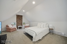 Guest Suite featuring wall-to-wall carpeting, large closet (leads to attic storage)