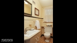 Original basket weave tile in this nicely located first floor powder room
