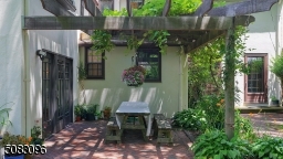 It's just so European! Relax under the grape arbor on this fabulous brick patio overlooking the expansive, private yard!
