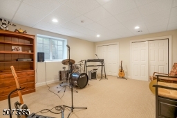 A large bedroom right off a full bath which is perfect for long-term guests or a music room!