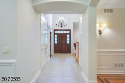 You'll be WOWed by the high ceilings and attention to detail throughout this custom home.