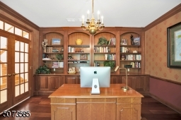 The perfect place to work from home with the custom mahogany bookshelves and elegant moldings.